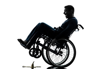 Fototapeta na wymiar fearless handicapped man in wheelchair silhouette