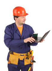 Worker with cup of coffee and laptop.