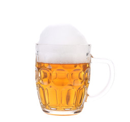 Full mug of beer with foam.