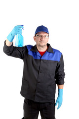 Man in workwear with a spray bottle