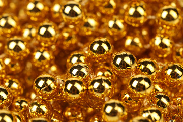 Close up of golden beads.