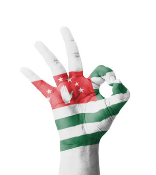 Hand making Ok sign, Abkhazia flag painted
