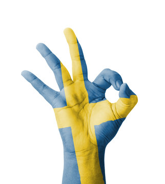Hand making Ok sign, Sweden flag painted