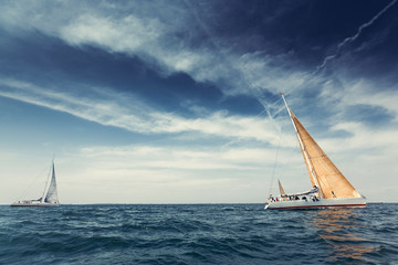 Sailing ship yachts with white sails