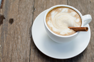 A cup of hot latte with cinnamon