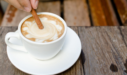 A cup of hot latte with cinnamon