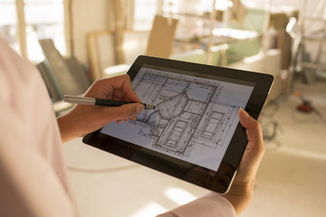 Architect woman working with electronic tablet