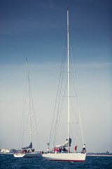Sailing ship yachts with white sails