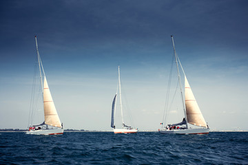 Sailing ship yachts with white sails