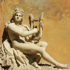 sculpture of ancient god with the lire instrument - 57571902