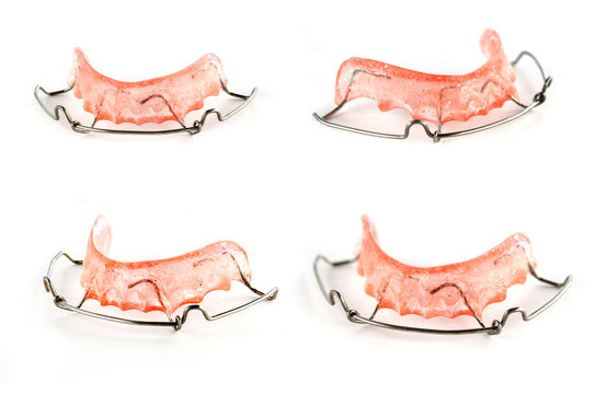 pink dental braces  on white background
