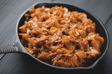 Cast-iron frying pan with braised cabbage, studio shot