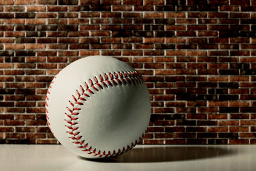 baseball on a brick wall
