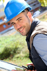 Fototapeta premium Construction manager using tablet on building site