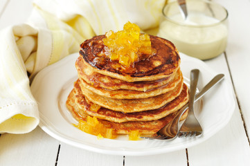A Stack of Pumpkin Pancakes Topped with Pumpkin Jam