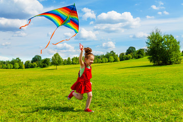 6 years old girl with kite - Powered by Adobe