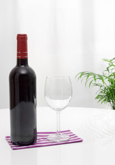 Bottle of wine and glass on the table