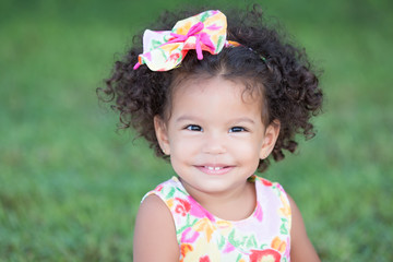 Cute and funny latin girl with an afro hairstyle © kmiragaya