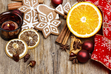 Gingerbread cookies, candle and cinnamon sticks. Traditional chr