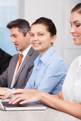 Businesspeople Using Laptop