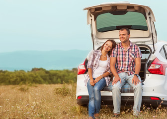 family in the mountains by car