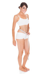 Fototapeta premium Young Woman With Measure Tape