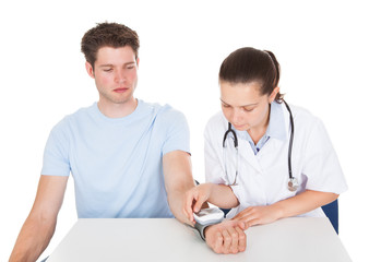 Doctor Examining Patient