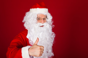 Fototapeta na wymiar Santa gesturing thumb-up