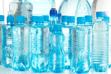 Different water bottles isolated on white