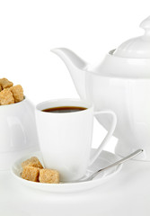 Cup of coffee, sugar-bowl and teapot isolated on white