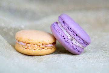 Macaroons on fabric background