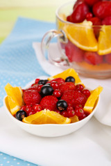 Useful fruit salad in glass cup and bowl