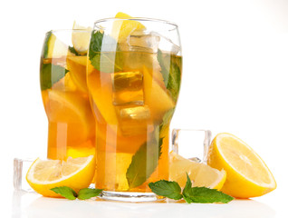Iced tea with lemon and mint isolated on white