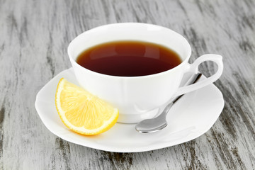 Cup of tea with lemon on table close-up