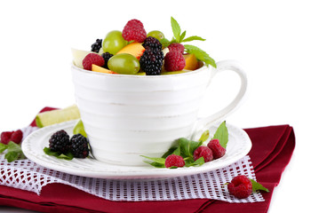Fruit salad in cup on napkin isolated on white