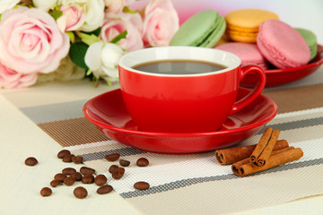 Coffee and macaroons on table close-up