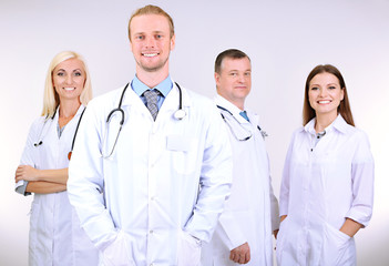 Fototapeta premium Medical workers on grey background