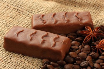 Delicious chocolate bars with coffee beans