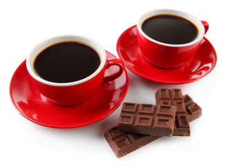 Red cups of strong coffee and chocolate bars isolated on white