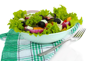 Greek salad on plate isolated on white