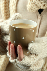 Obraz na płótnie Canvas Female hands with hot drink, close-up