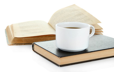 Cup of coffee and books isolated on white