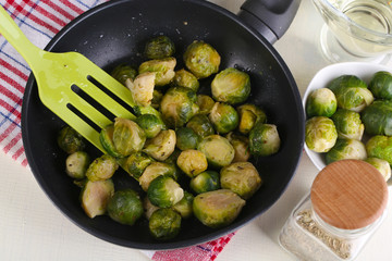 Fresh brussels sprouts in pan with vegetables and spices