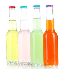 Drinks in glass bottles isolated on white