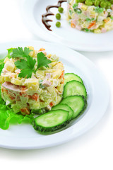 Russian traditional salad Olivier, isolated on white