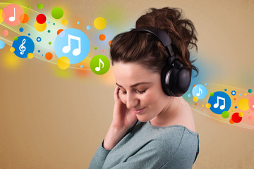 Young woman listening to music with headphones