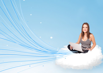 Fototapeta na wymiar Young woman sitting in cloud with laptop