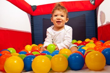 Obraz premium Happy baby boy having fun