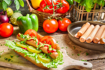 Fresh hot dog with sausage and vegetables