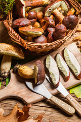 Cutting forest mushrooms in a pan